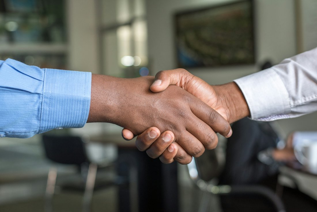 HomeDosthi team welcoming a new service partner with a handshake